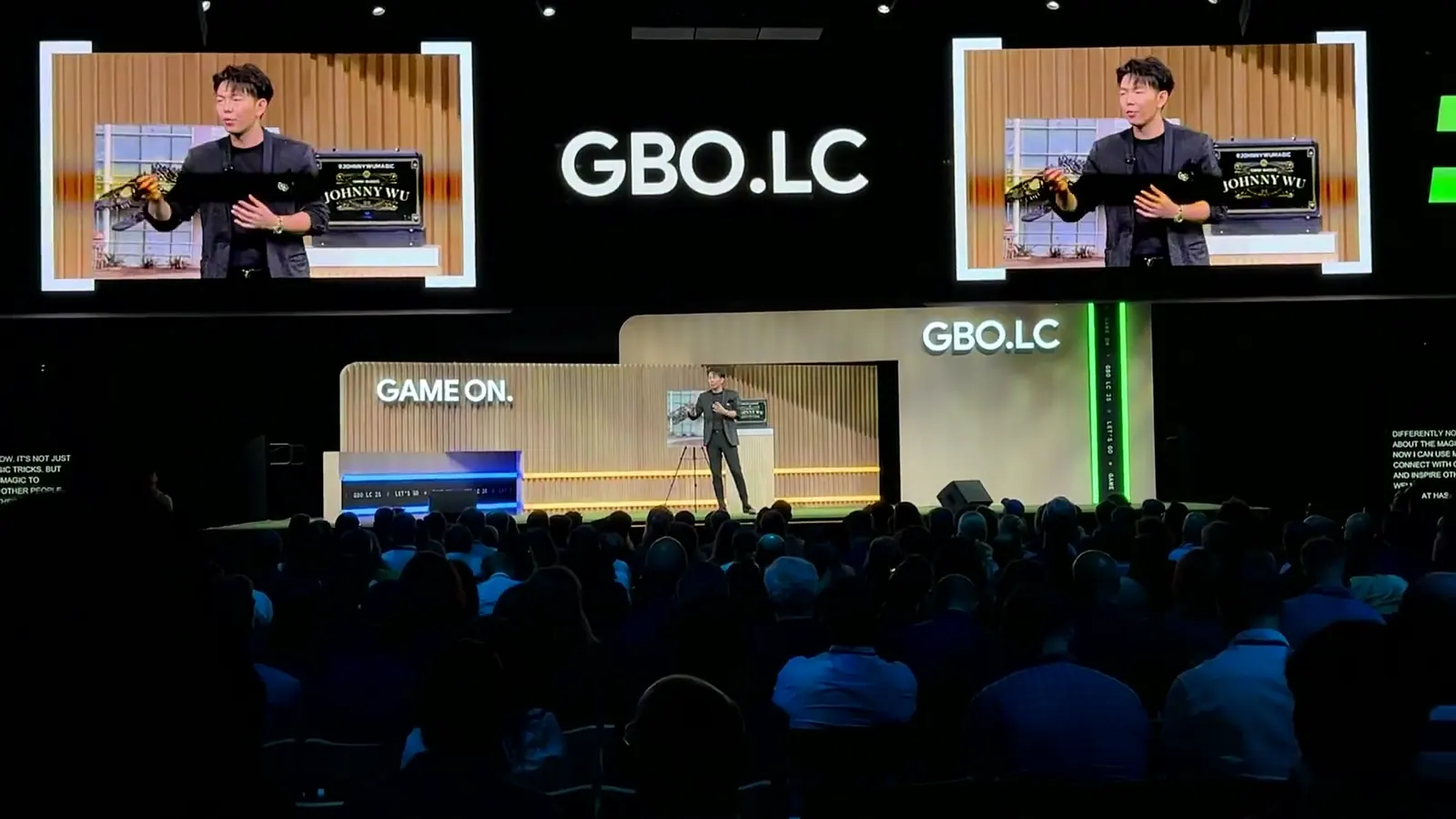 Asian magician keynote speaker Johnny Wu performing on stage at Google HQ in front of about 700 executives